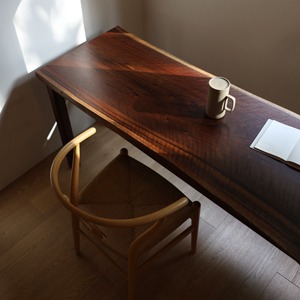 walnut round-leg woodslab table